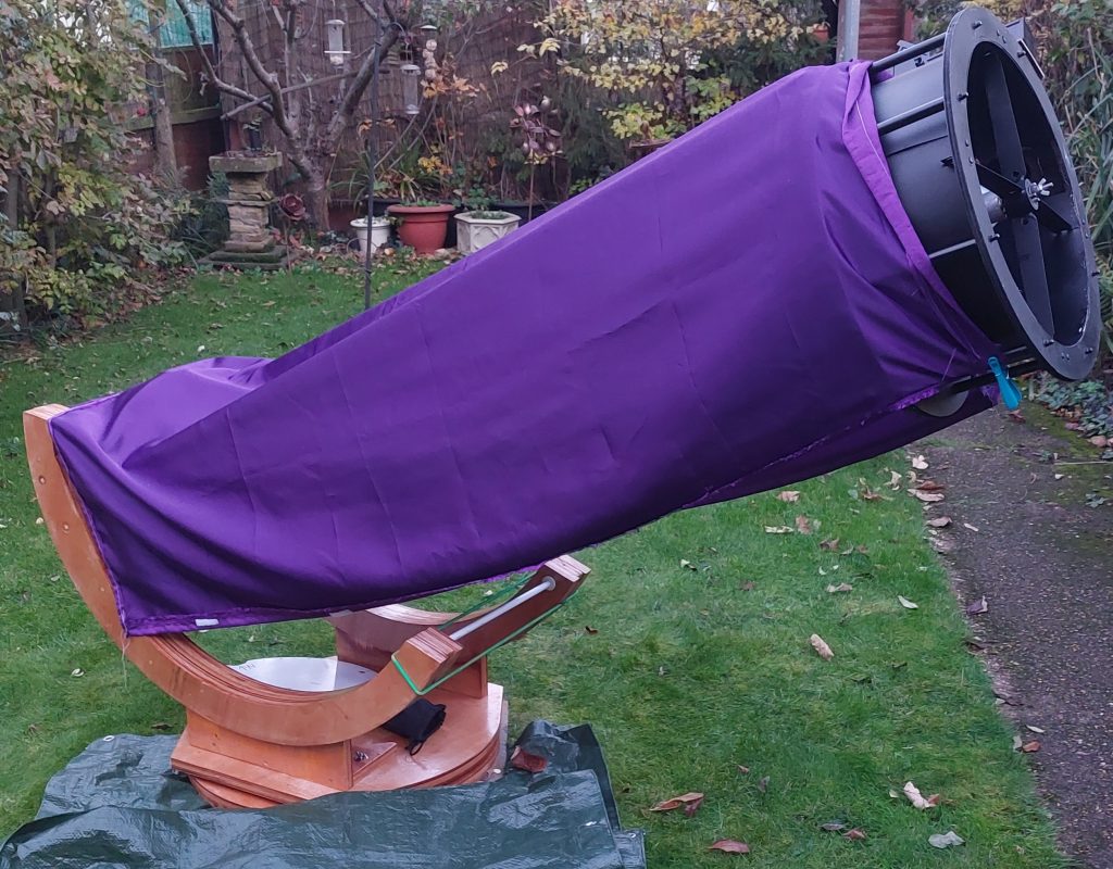 Telescope with purple cloth cover